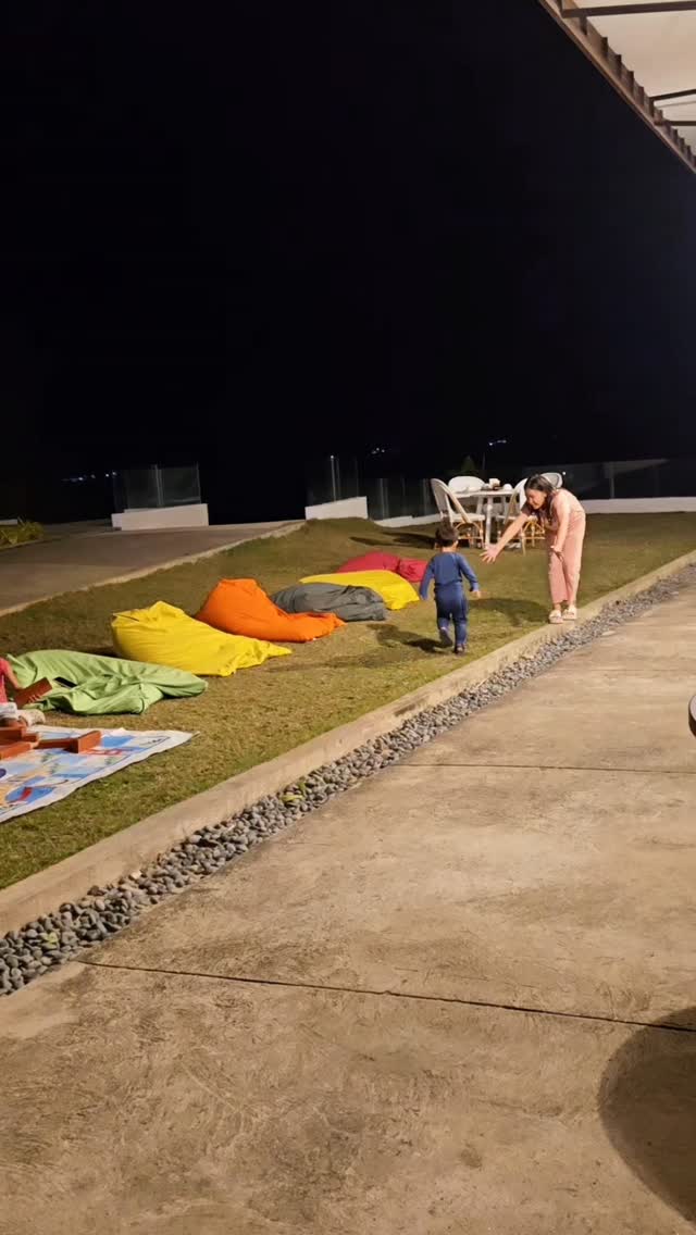 Family enjoying an outdoor evening on the resort lawn at Dasol Beach Villas