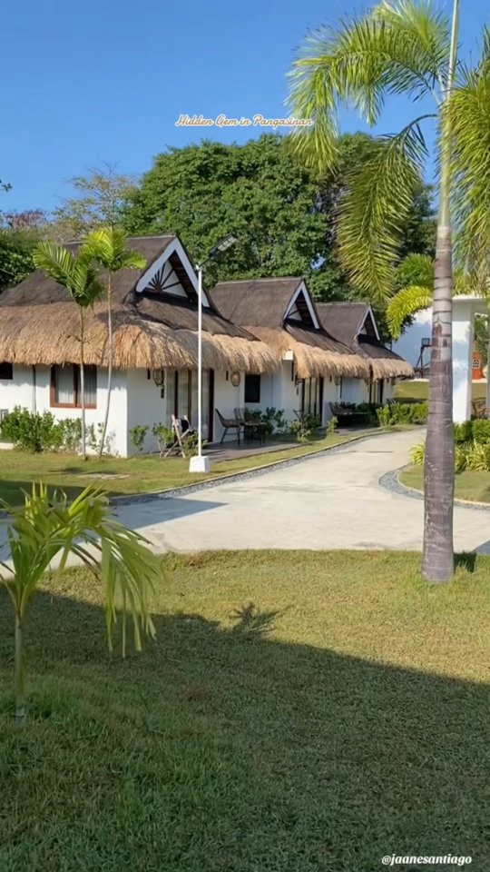 Nipa-style Beach Huts at Dasol Beach Villas with thatched roofs and lush garden path